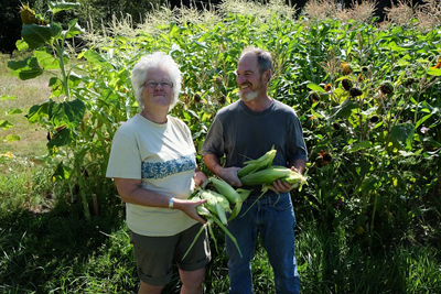 Two farmers with corn