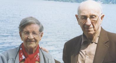 Owen and Elsie Williams in front of a lake.