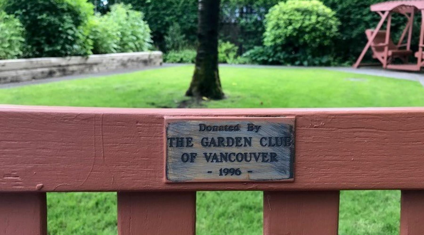 A bench donated to a garden by The Garden Club of Vancouver. 