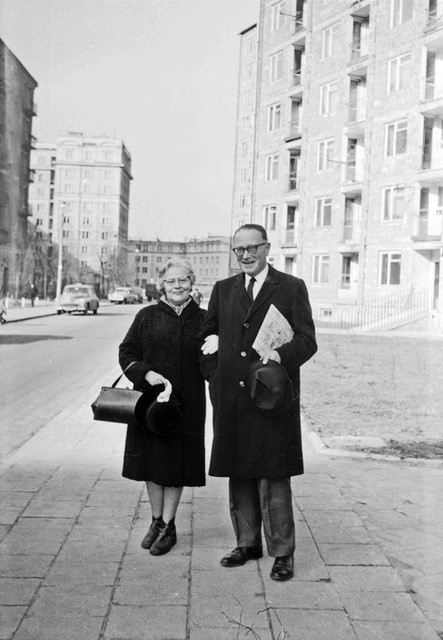 Black and white portrait photograph of Marta and Stefan standing together on the sidewalk