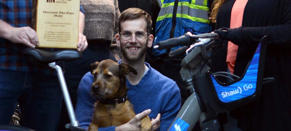Mobi Bikes Living Wage Employer Photo with Puppy