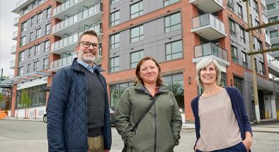 L to R: Lance Jakubec, CMHC; Kira Gerwing, former senior manager community investment, Vancity Credit Union; and, Irene Gannitsos, senior manager strategic initiatives and investment, Vancity Community Foundation outside Aspen, a 145-unit affordable housing development in Vancouver’s Mount Pleasant neighbourhood.
