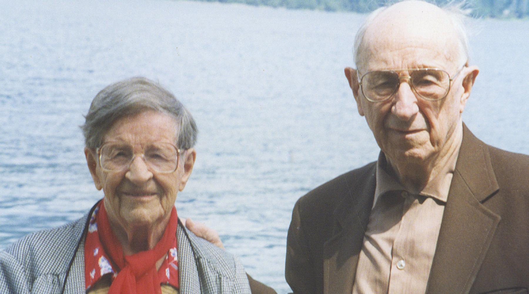 Owen and Elsie Williams in front of a lake.