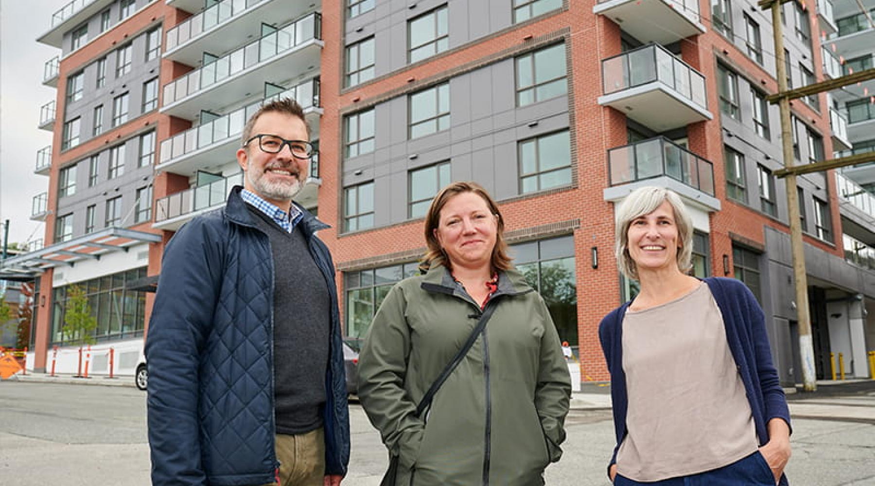 L to R: Lance Jakubec, CMHC; Kira Gerwing, former senior manager community investment, Vancity Credit Union; and, Irene Gannitsos, senior manager strategic initiatives and investment, Vancity Community Foundation outside Aspen, a 145-unit affordable housing development in Vancouver’s Mount Pleasant neighbourhood.
