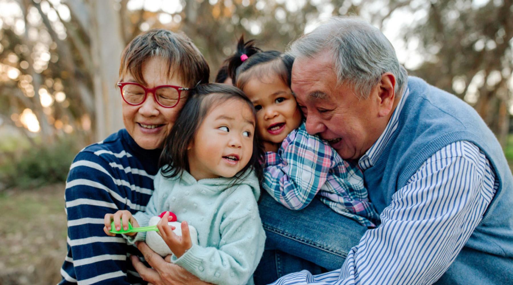 family sharing an embrace, grandparents and grandchildren